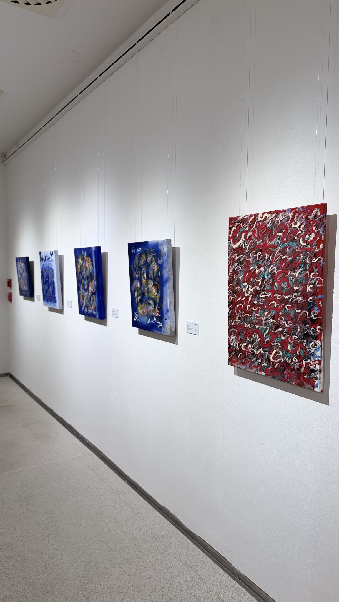 Blue and red works installed in sequence
