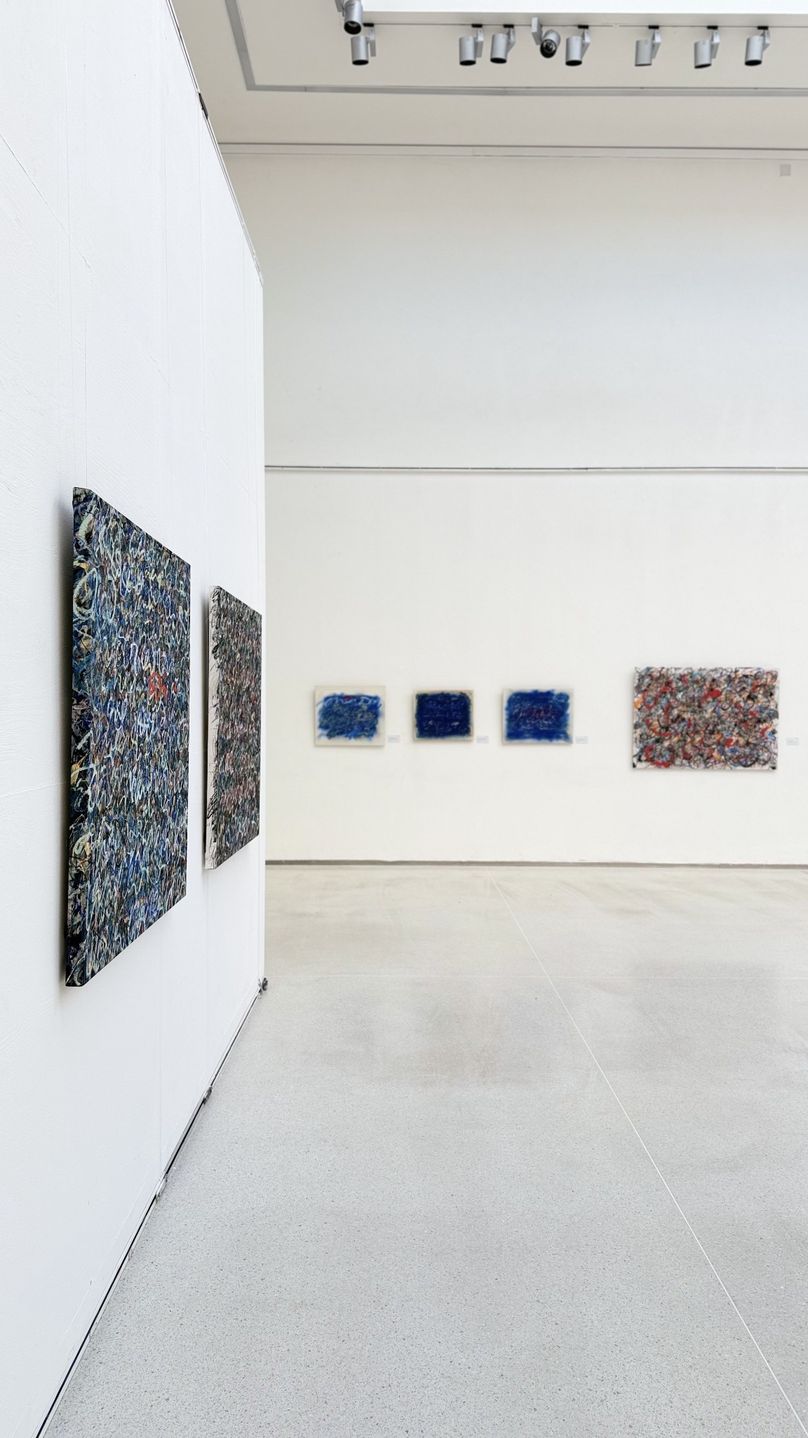 Paintings seen through the architecture of Galerie Mánes