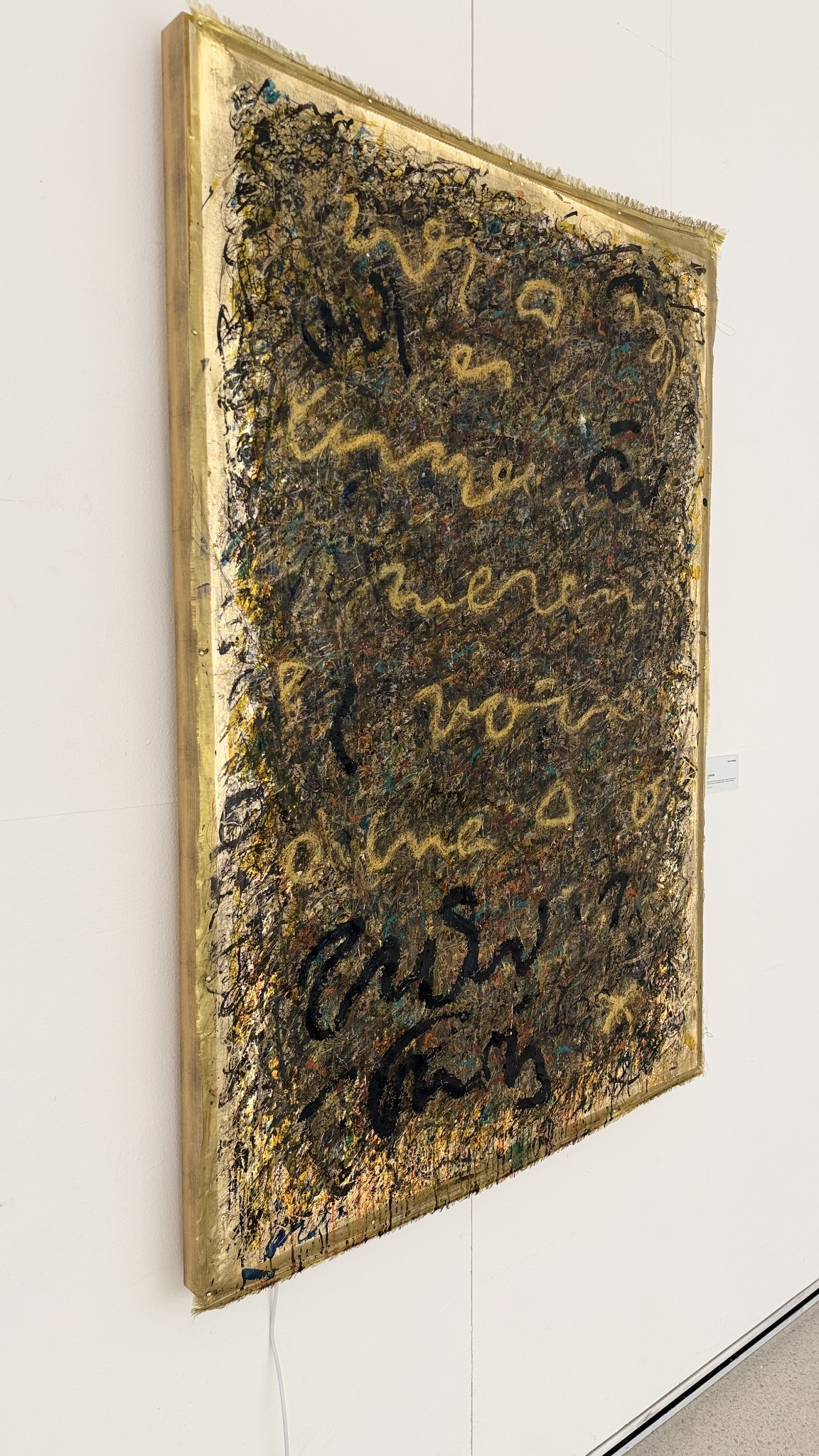 The gold and black painted edge of Oracle