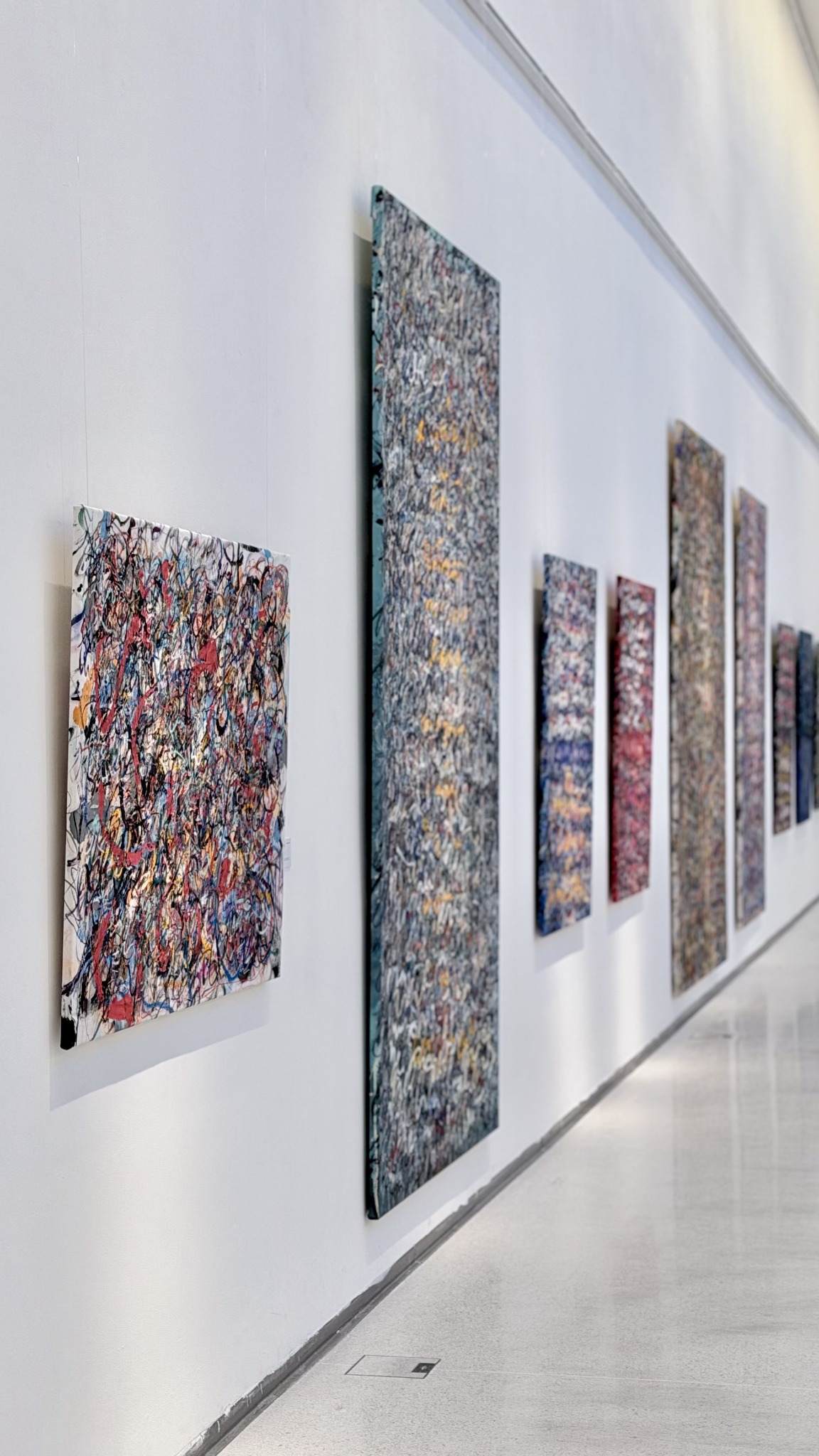 Anima Mundi paintings extending along the north wall