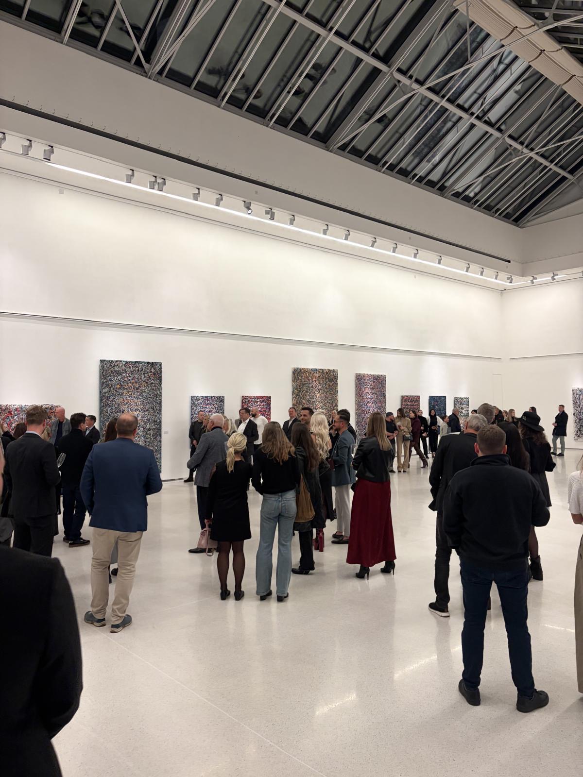 Visitors moving through Anima Mundi during the opening