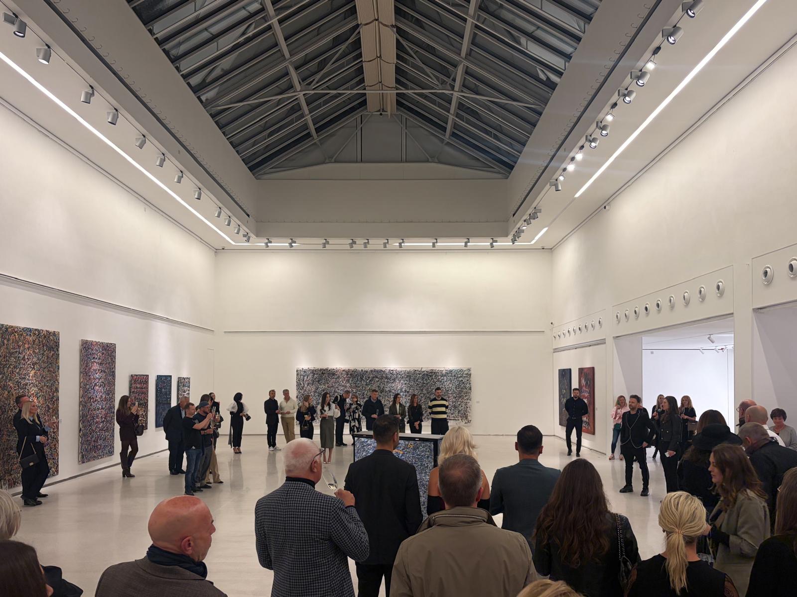 Visitors gathered for the opening of Anima Mundi